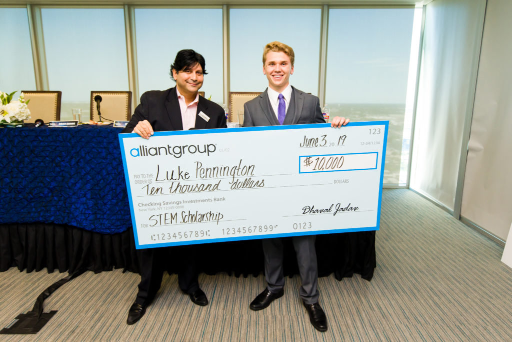 Luke and Dhaval with check